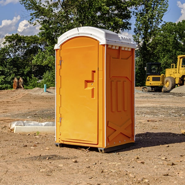 what is the cost difference between standard and deluxe portable restroom rentals in Freeborn County